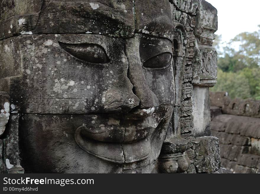 The stone Buddha face at Angkor Wat, Bayon, Cambodia. The stone Buddha face at Angkor Wat, Bayon, Cambodia.