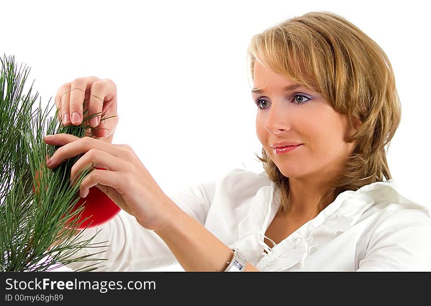 Beautiful woman with christmas balls over white