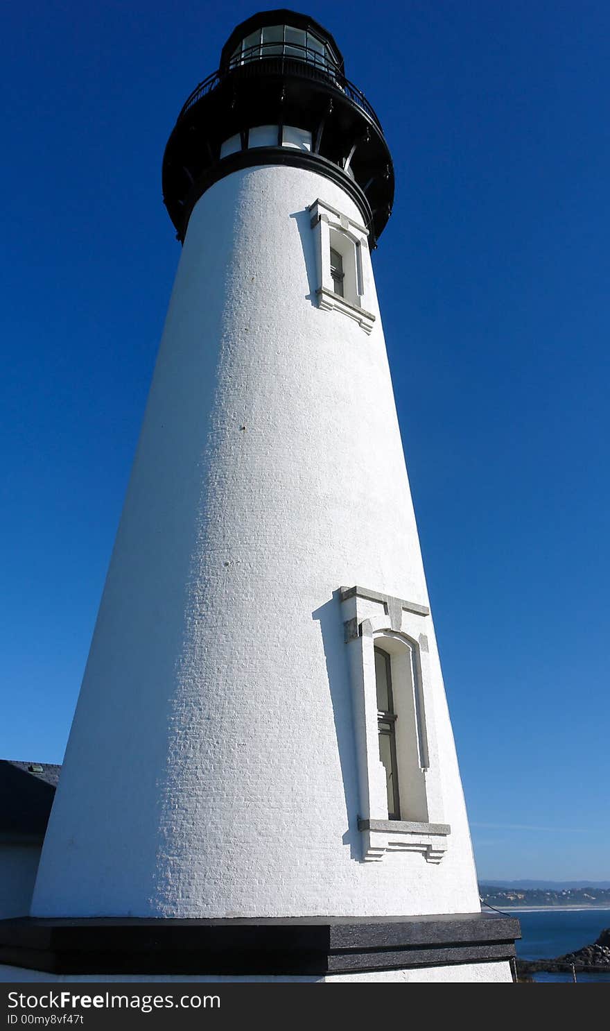 Looking up at an old stately lighthouse in oregon. Looking up at an old stately lighthouse in oregon