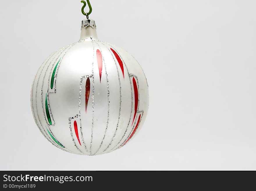 Christmas decoration - glass ball isolated on light background