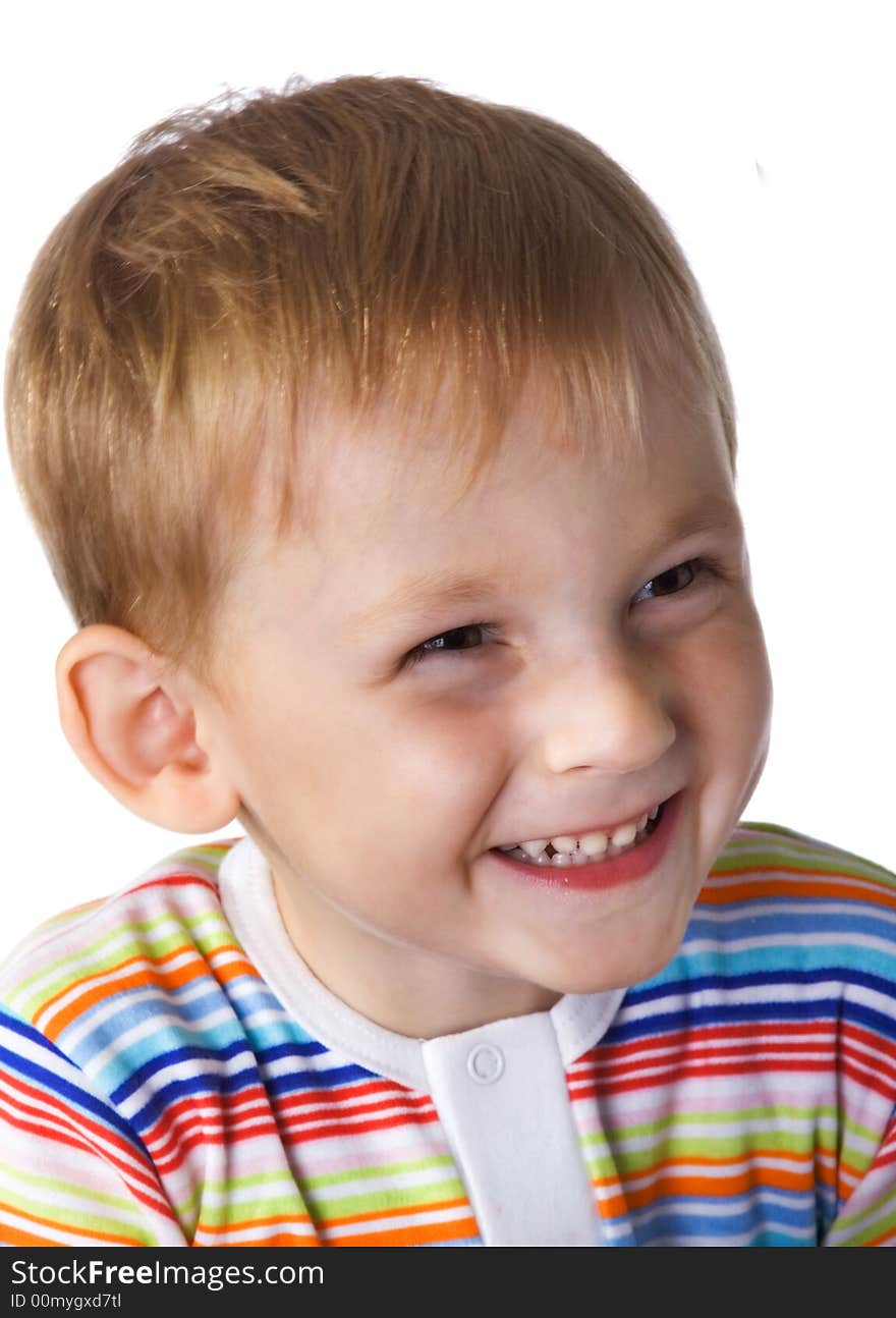 The laughing little boy on a white background