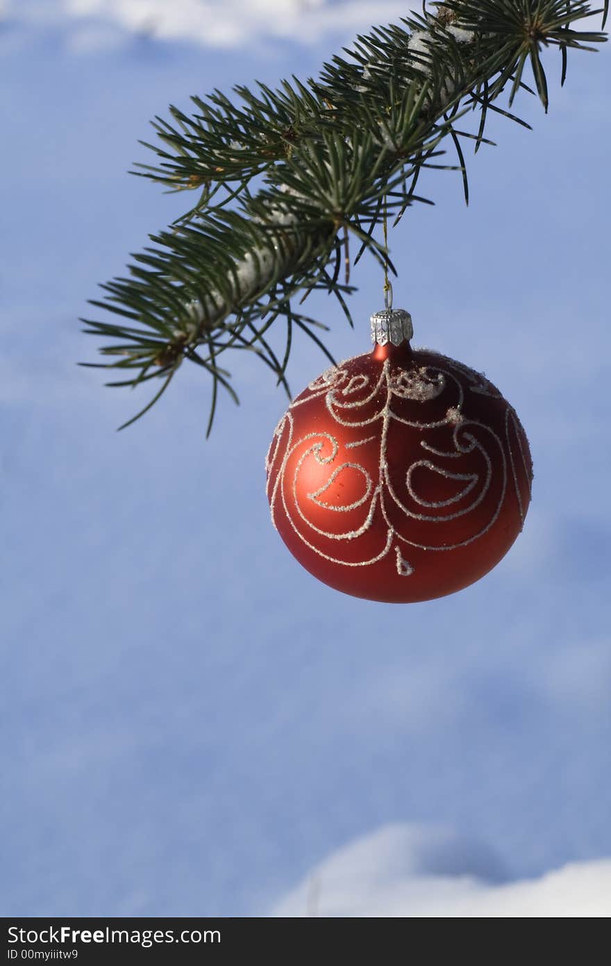 Christmas as tree decoration handing on fir tree covered with snow. Christmas as tree decoration handing on fir tree covered with snow