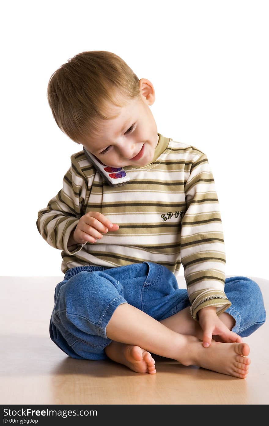 Little boy speaks by phone