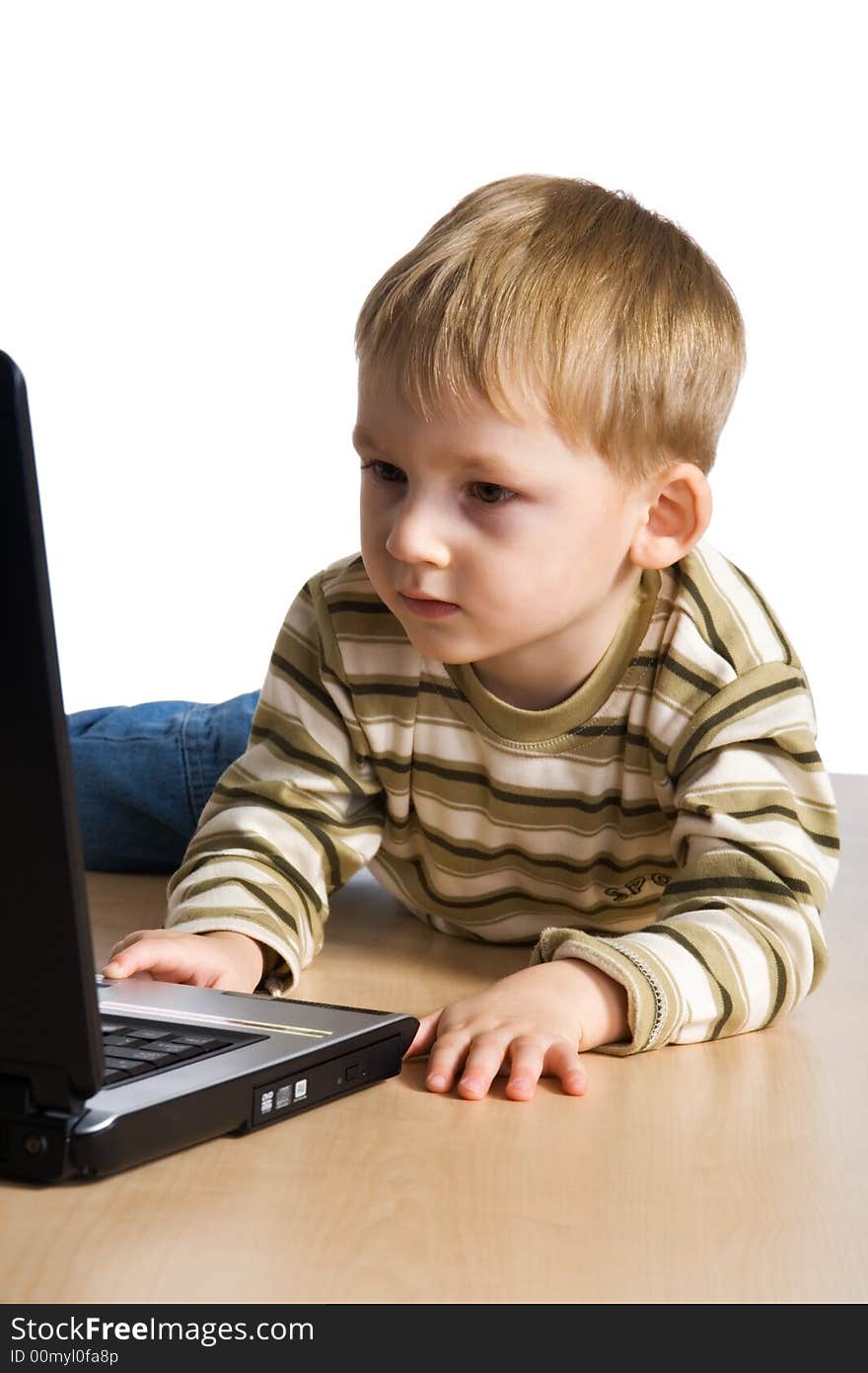 The young boy using a laptop