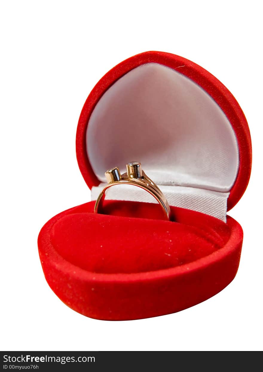 The golden ring in red box in shape of heart, maybe engagement. Isolated on a white background, working path included.