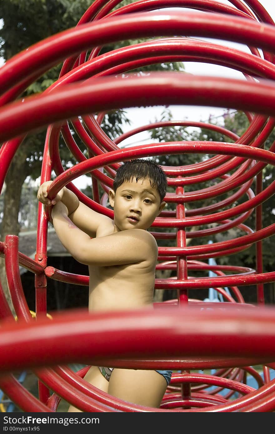 Kid Playing In Playground