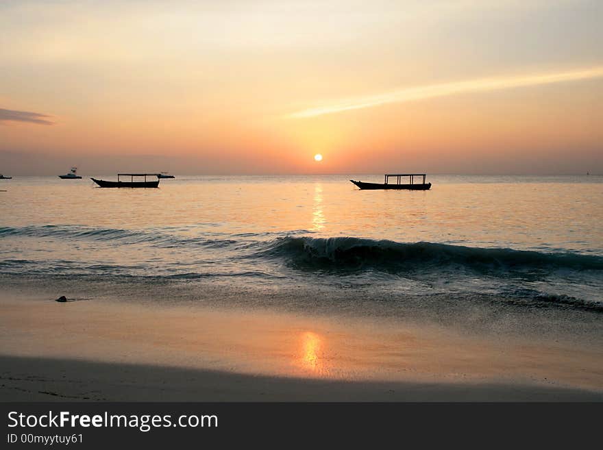 Sun go down over sea, photo from seaside on Zanzibar (Tanzania, Africa). Sun go down over sea, photo from seaside on Zanzibar (Tanzania, Africa).