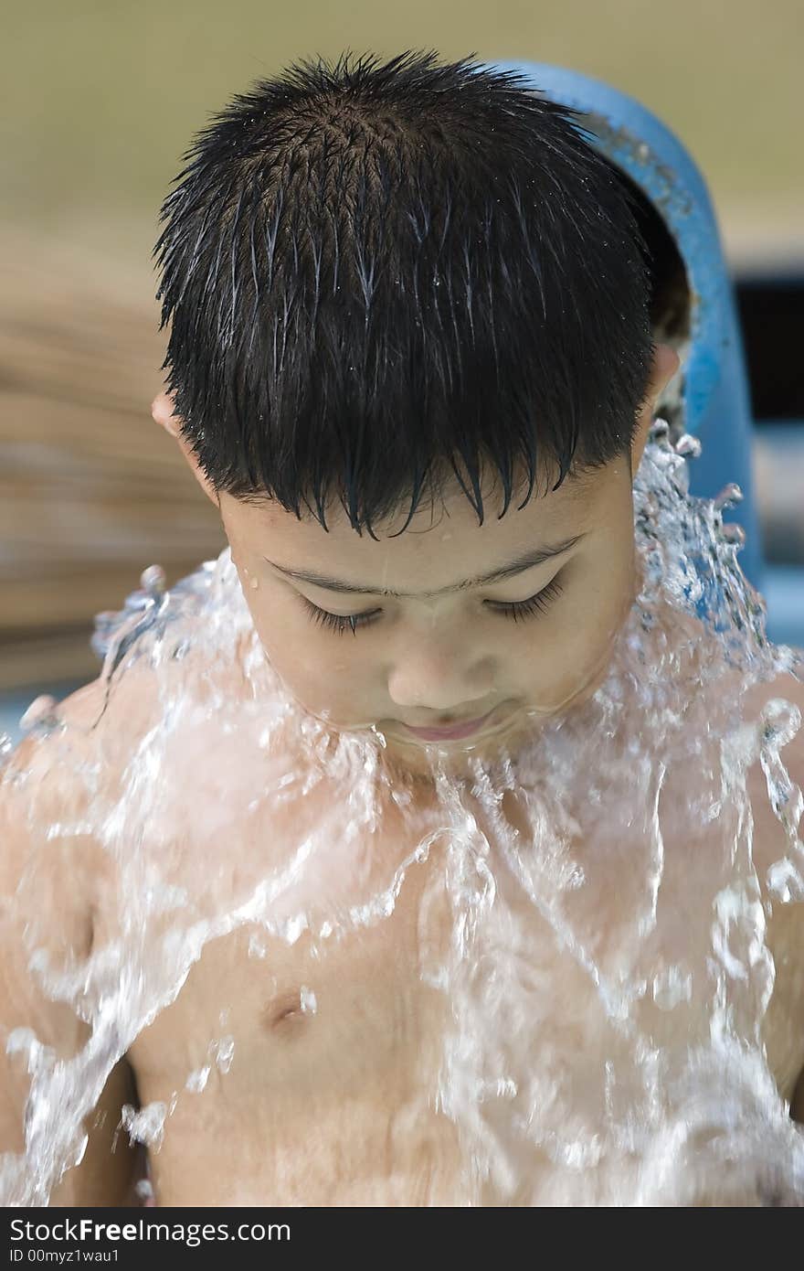 Kid playing with waterfountain