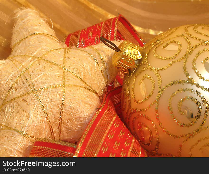 Christmas background with  golden ball, stars and red ribbons. Christmas background with  golden ball, stars and red ribbons