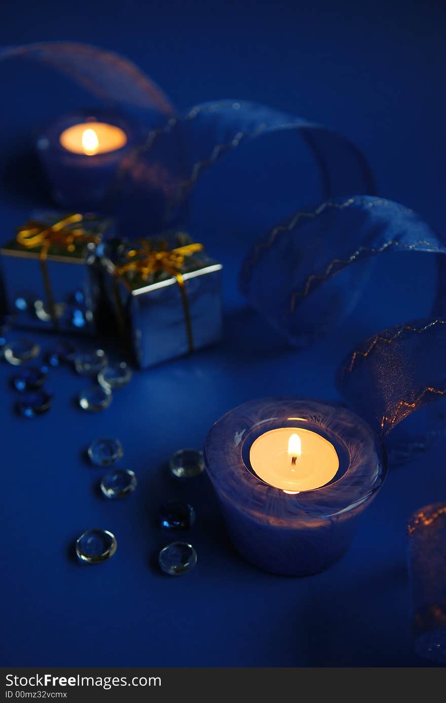 Blue candles and ribbon, holiday decoration