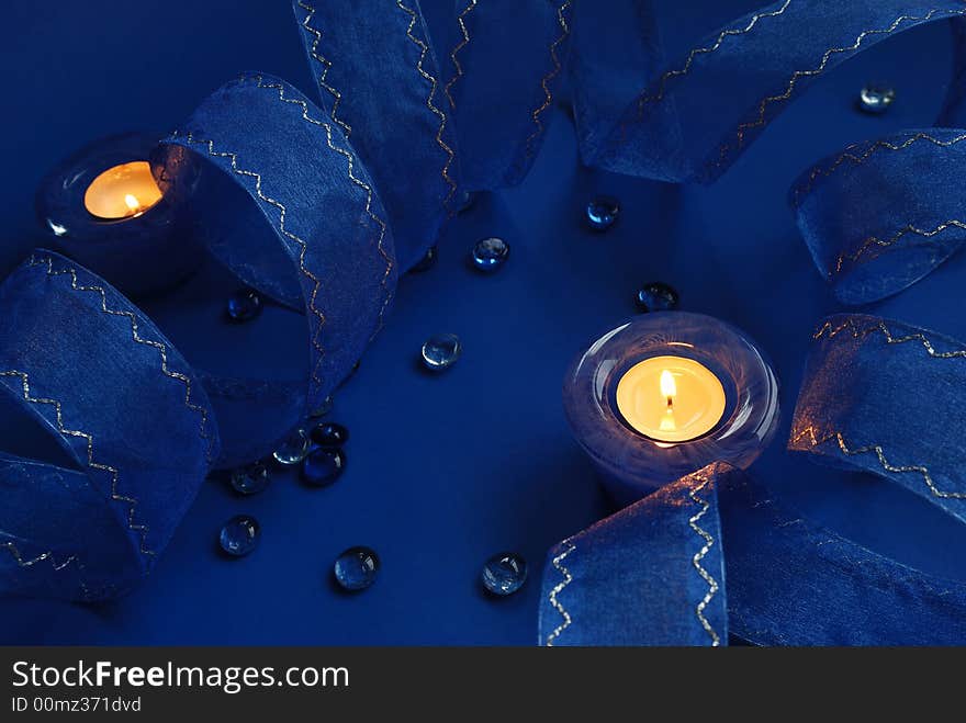 Blue candles and ribbon, holiday decoration