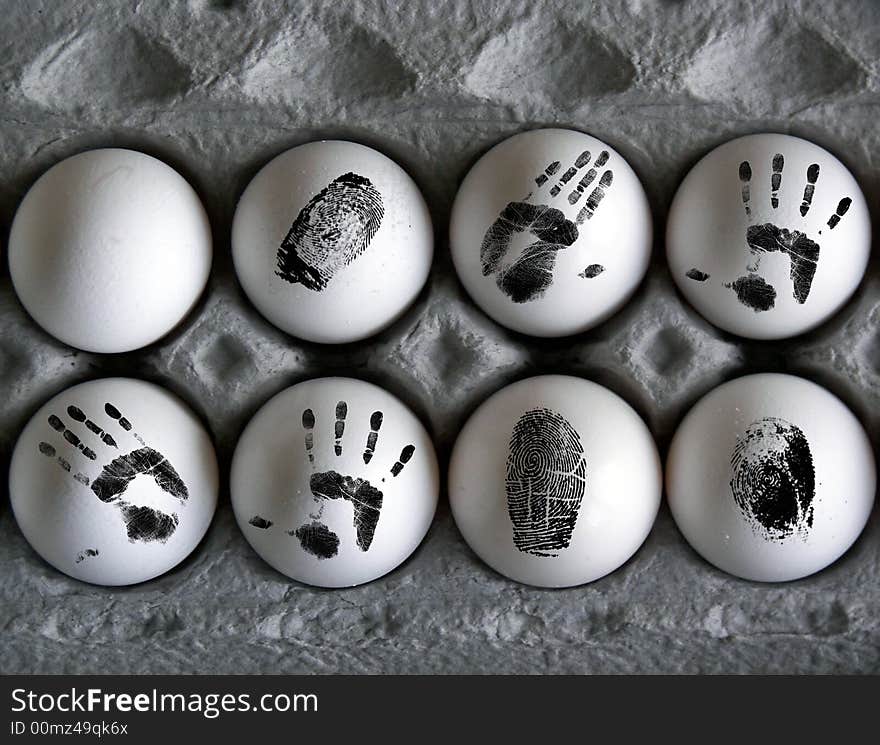 Eight eggs with finger and hand prints on the shell. Eight eggs with finger and hand prints on the shell.