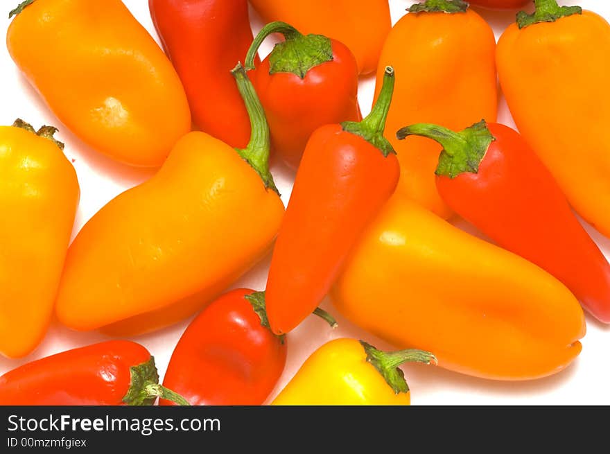 Fresh sweet peppers on white background, with copy space