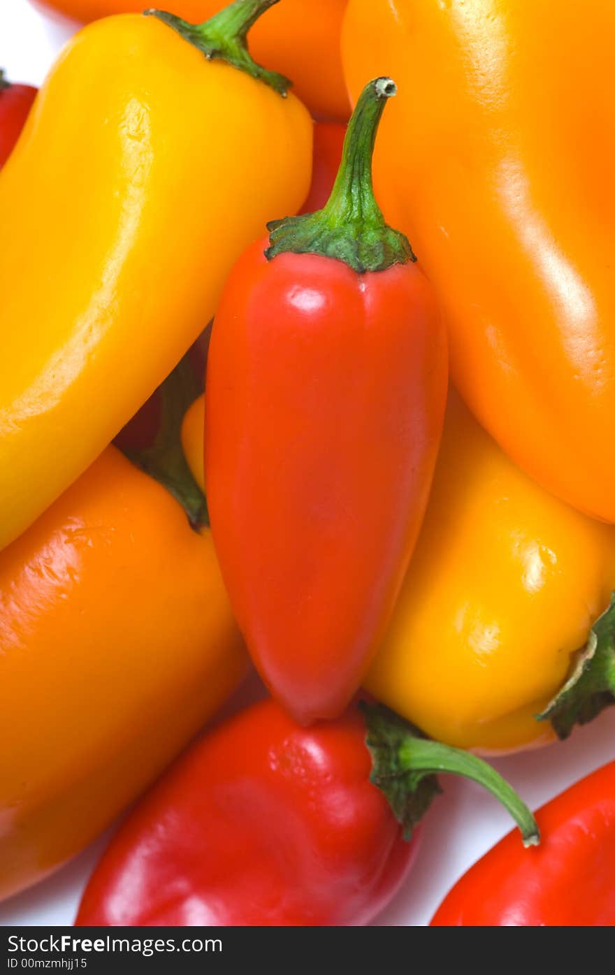 Fresh sweet peppers on white background, with copy space