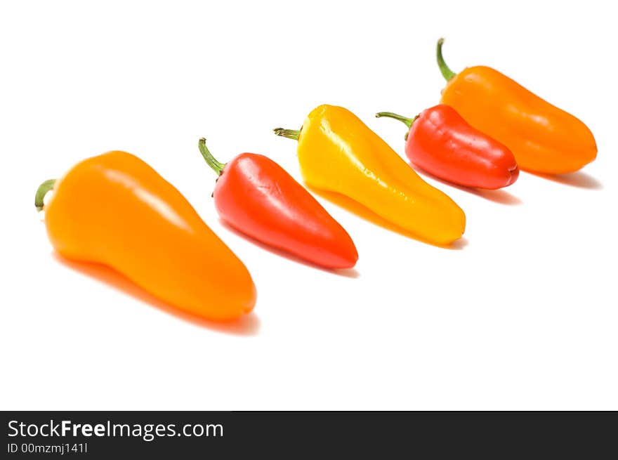 Fresh sweet peppers on white background, with copy space