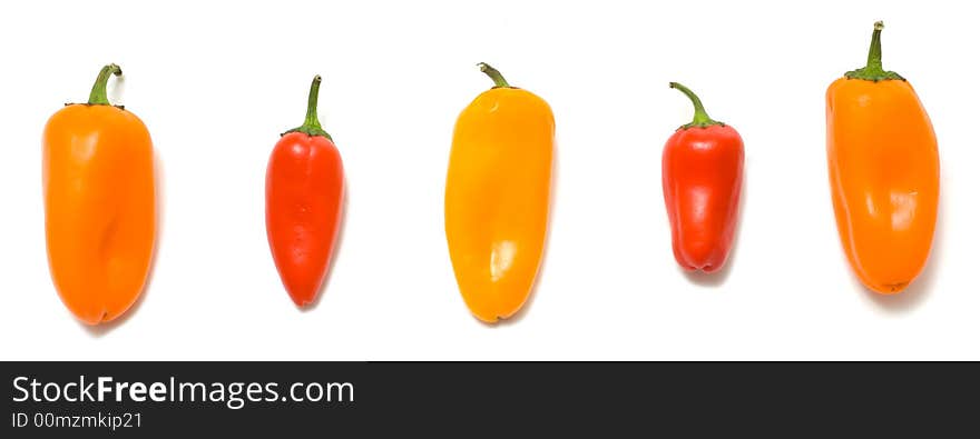 Fresh sweet peppers on white background, with copy space