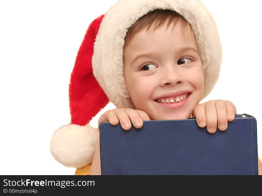 The happy BOY In the NEW YEAR'S CAP on a white background