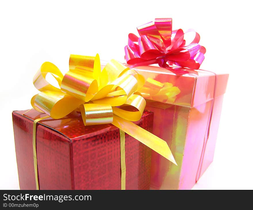 Gifts in red and pink boxes on a white background