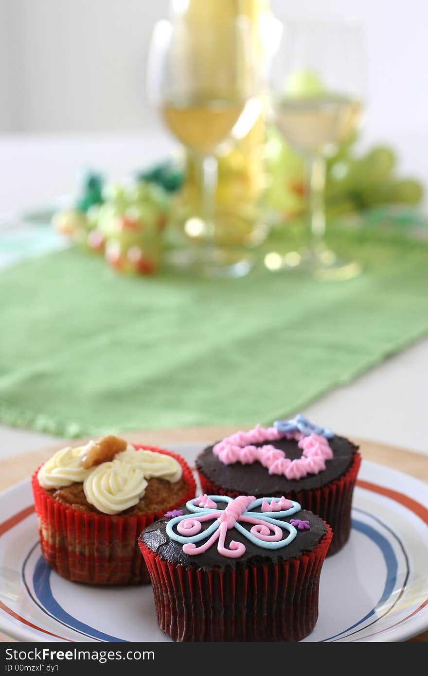 Fancy carrot and chocolate cupcakes with icing design on top