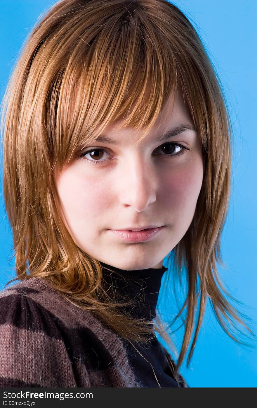 The girl looks, isolated on a dark blue background. The girl looks, isolated on a dark blue background.