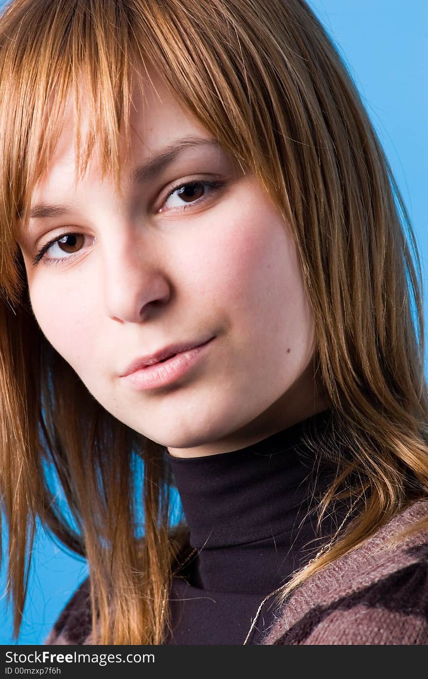 The girl looks, isolated on a dark blue background. The girl looks, isolated on a dark blue background.