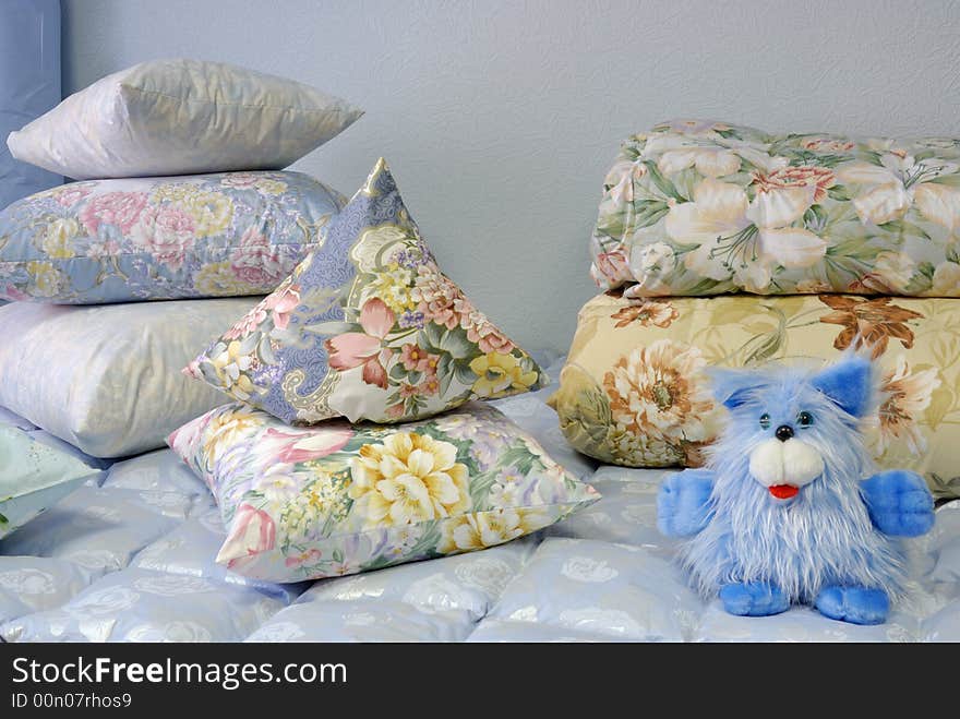 Stacks of pillows on a bed