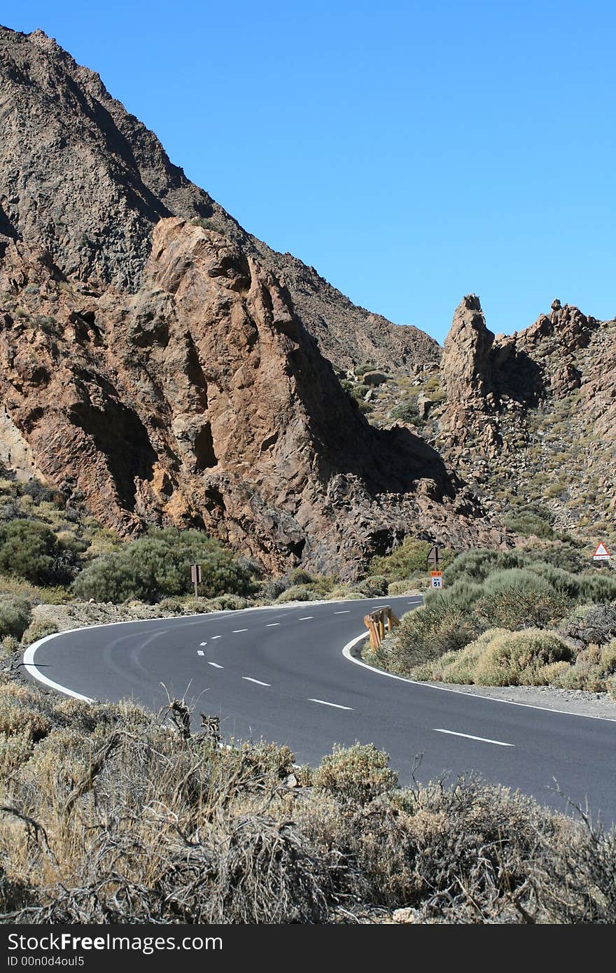 The mountain road and the blue sky as a background.