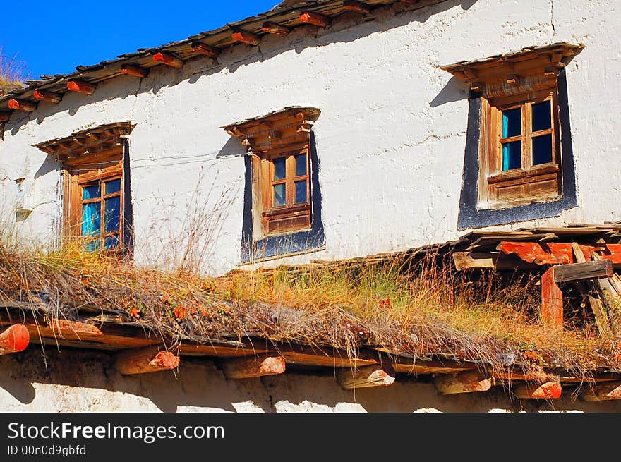 It's Tibet style house with tradition wood windows and white wall.