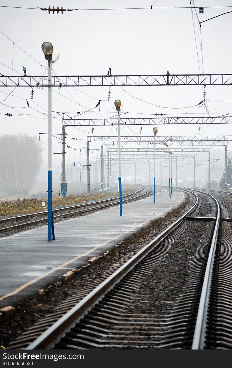 Railroad station with a lot of lamps