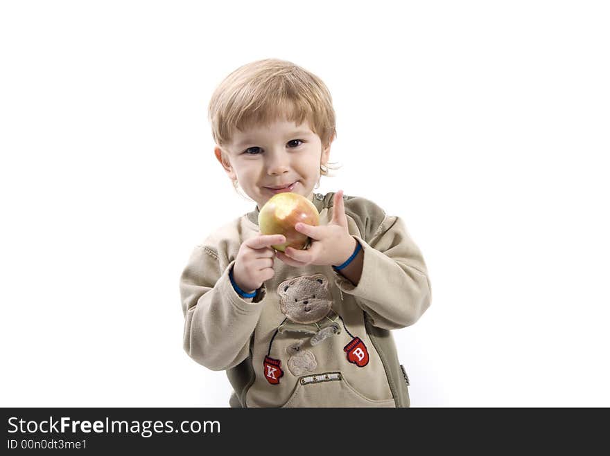 Young girl is smiling and holding apple