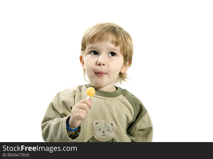 Young girl eating a candy