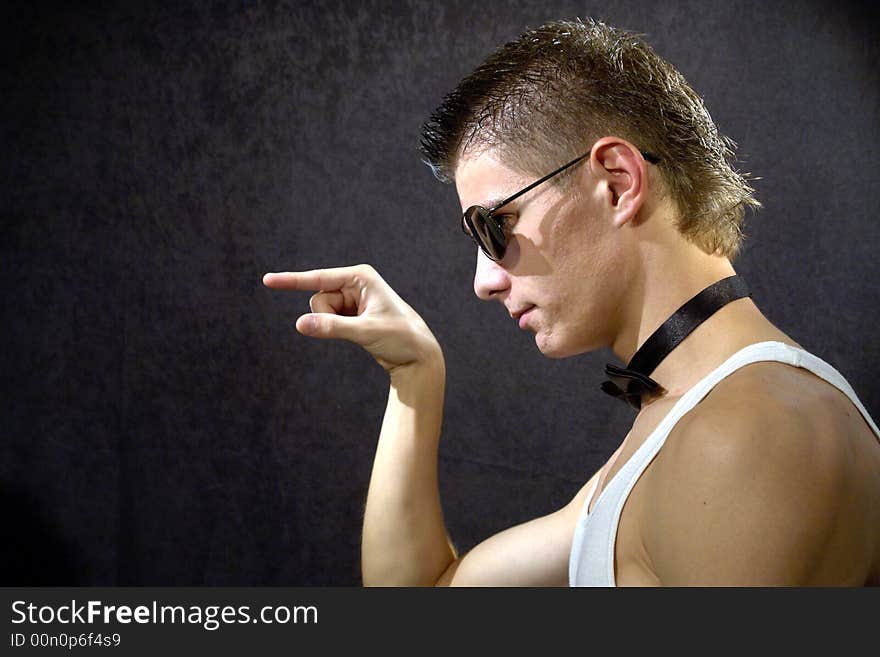 Great looking guy shot in studio - pointing right. Great looking guy shot in studio - pointing right