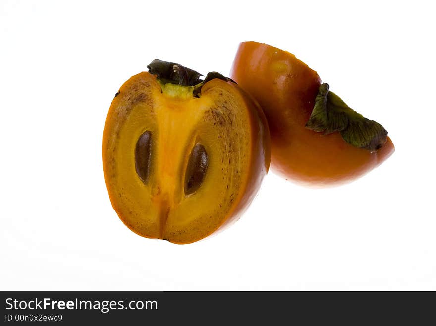 Isolated Fruit persimmon cutted half to half