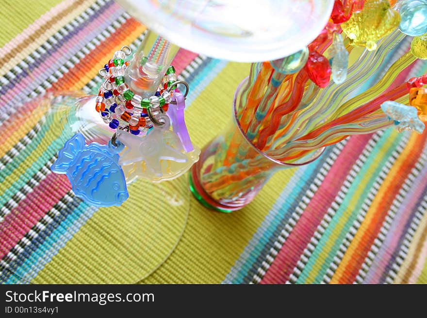 Martini Glass and Cocktail Sticks on a colorful placemat