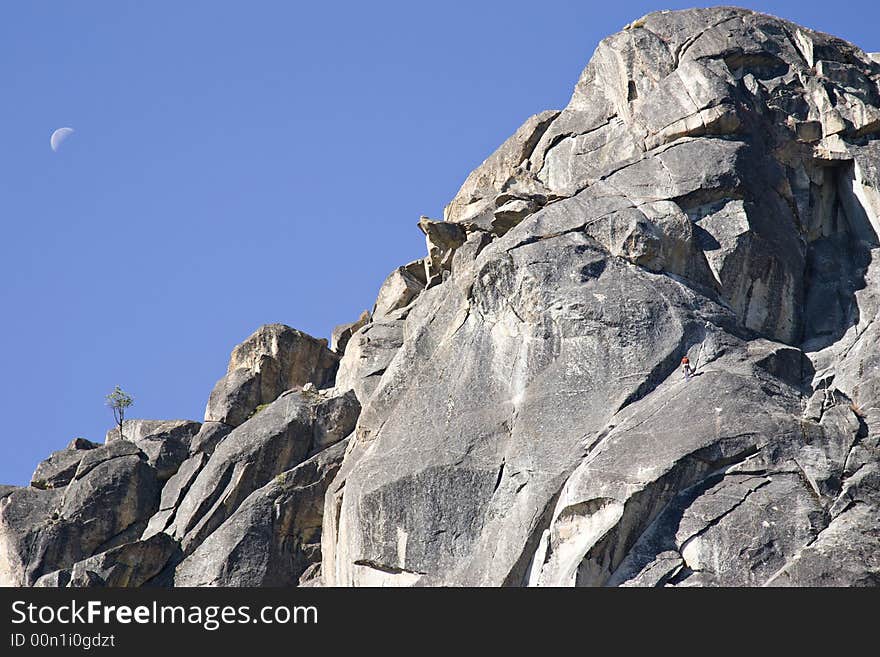 Rock climber at donner pass california blue sky quarter moon