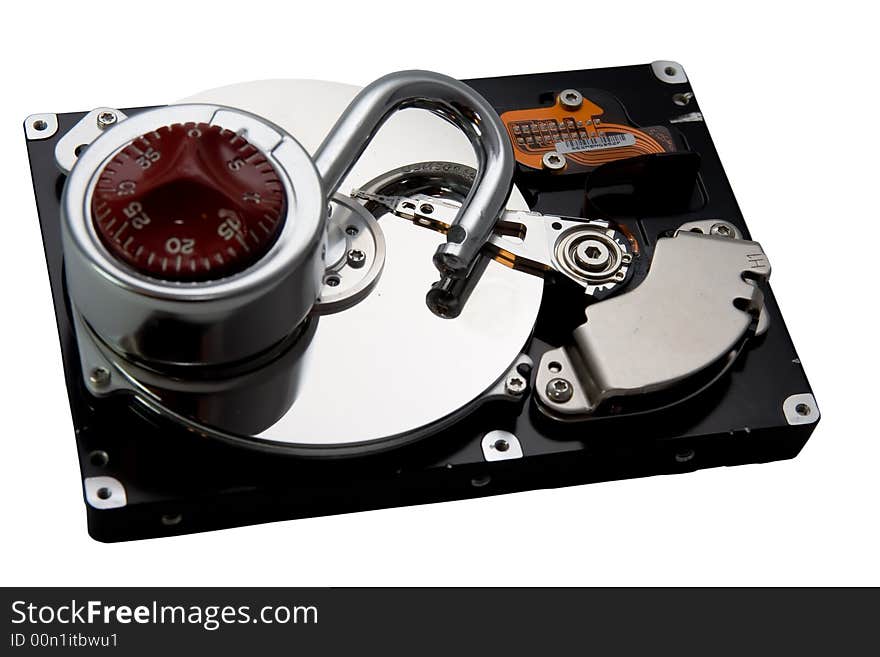 An exposed hard drive platter with an lock. An un-secured (insecure?) hard drive. Lack of computer security. An exposed hard drive platter with an lock. An un-secured (insecure?) hard drive. Lack of computer security.