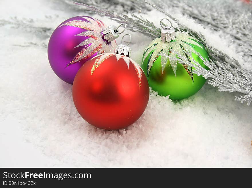 Christmas ornament on silver branch of pine + snow. Christmas ornament on silver branch of pine + snow