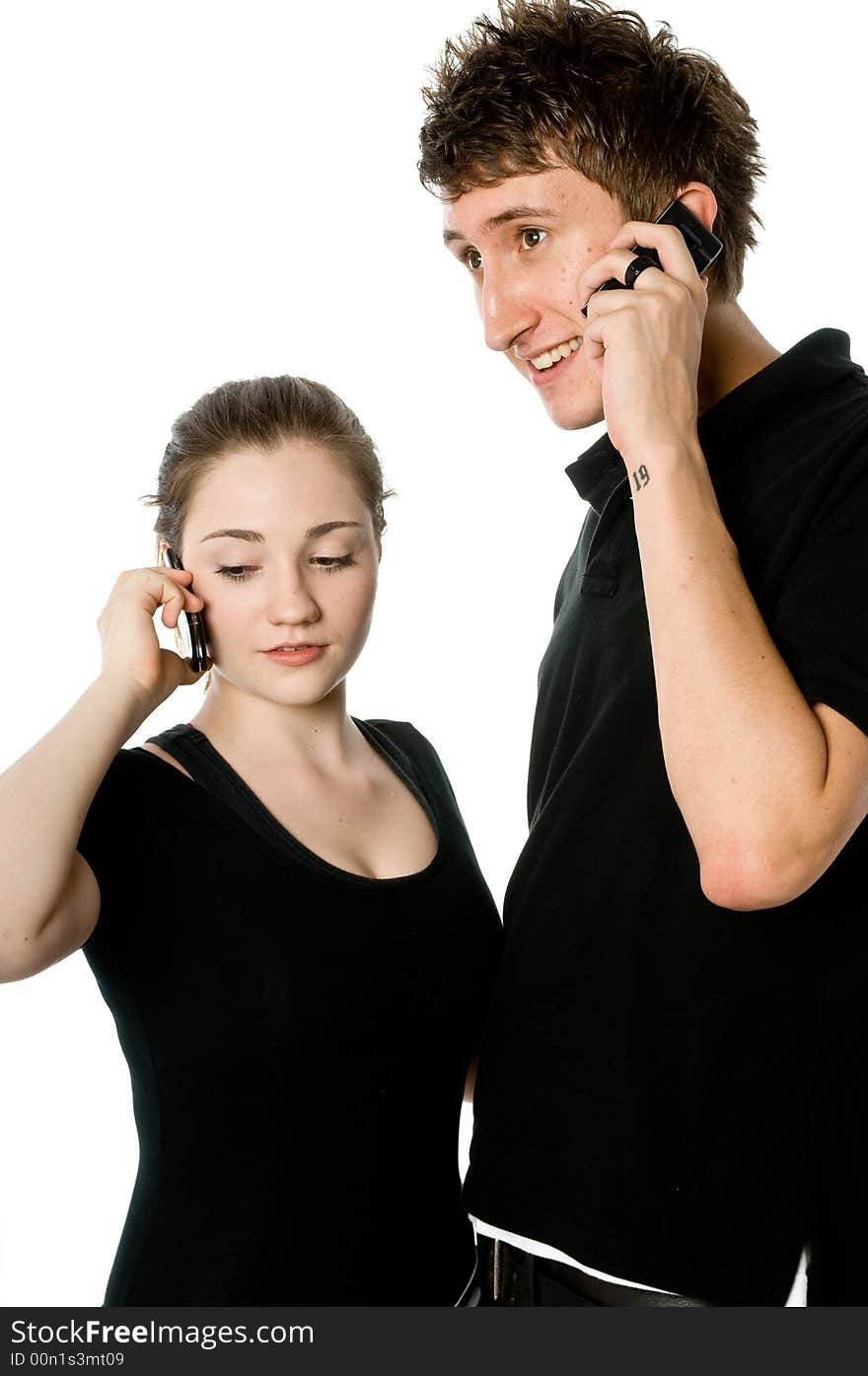 A young couple on the phone together. A young couple on the phone together