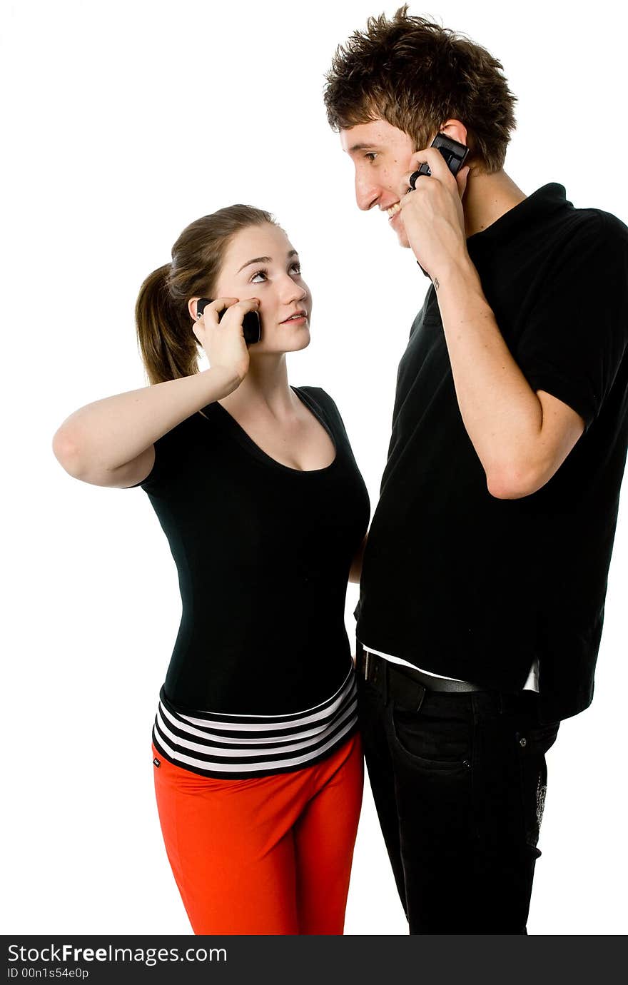 A young couple on the phone together. A young couple on the phone together