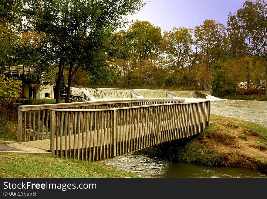 Walking bridge over water to the damn in the background. Walking bridge over water to the damn in the background.