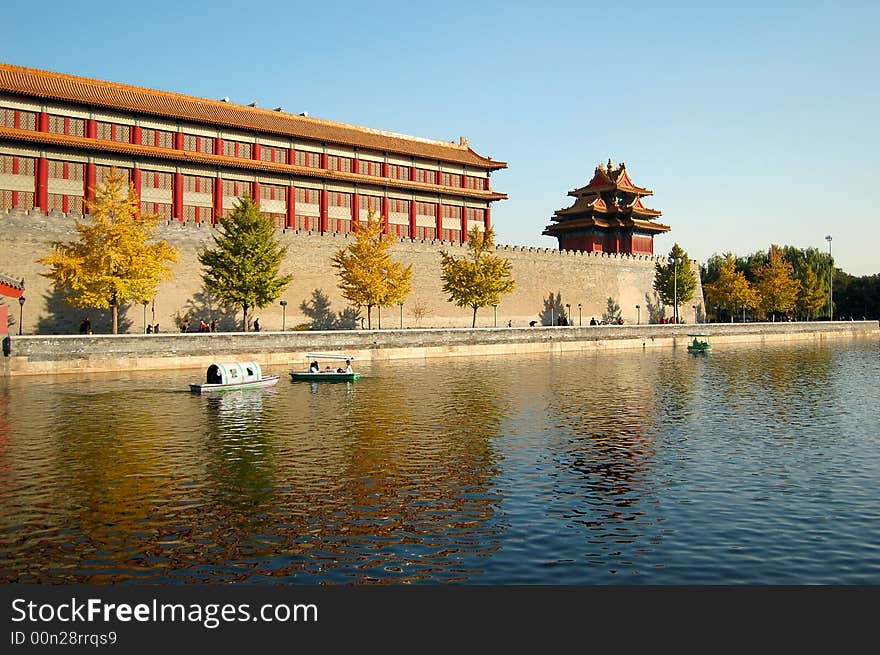 Moat, turret and buildings inside the wall in forbidden city, Beijing, China. Moat, turret and buildings inside the wall in forbidden city, Beijing, China.