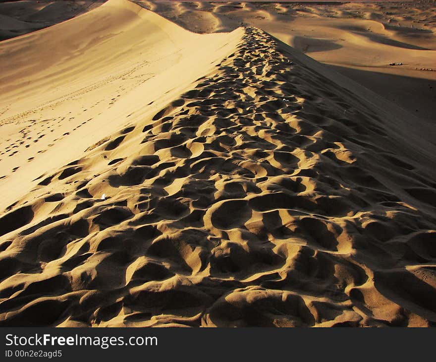 Wide desert has light side and shadow. Wide desert has light side and shadow