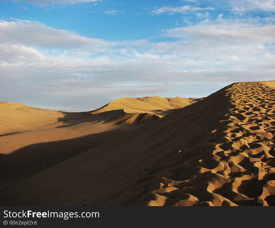 Wide desert has light side and shadow. Wide desert has light side and shadow