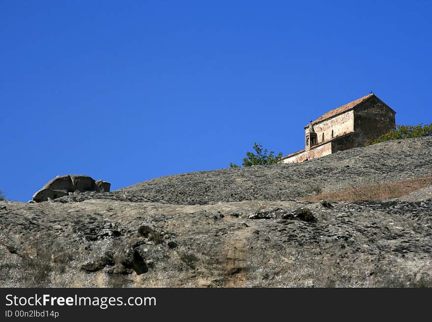 House in the Caucasus mountains with blue sky