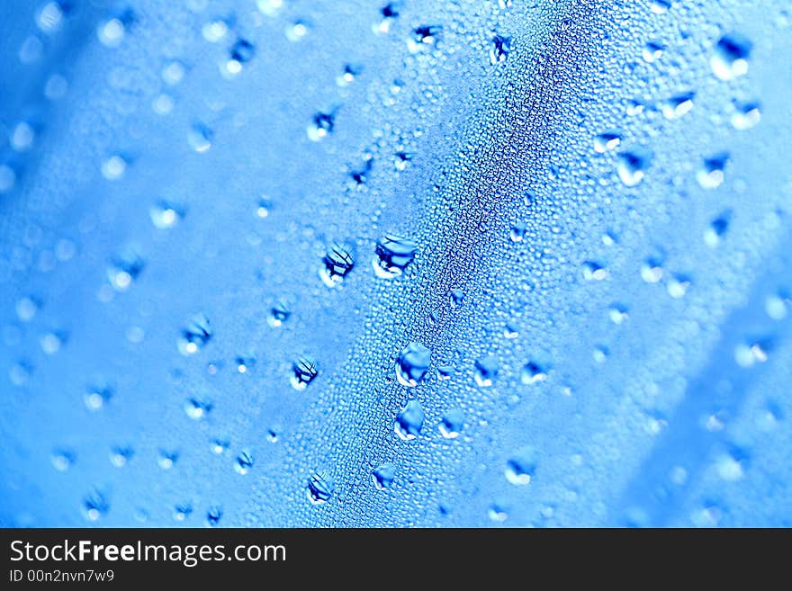 A detail of water condensed on window glass. A detail of water condensed on window glass.