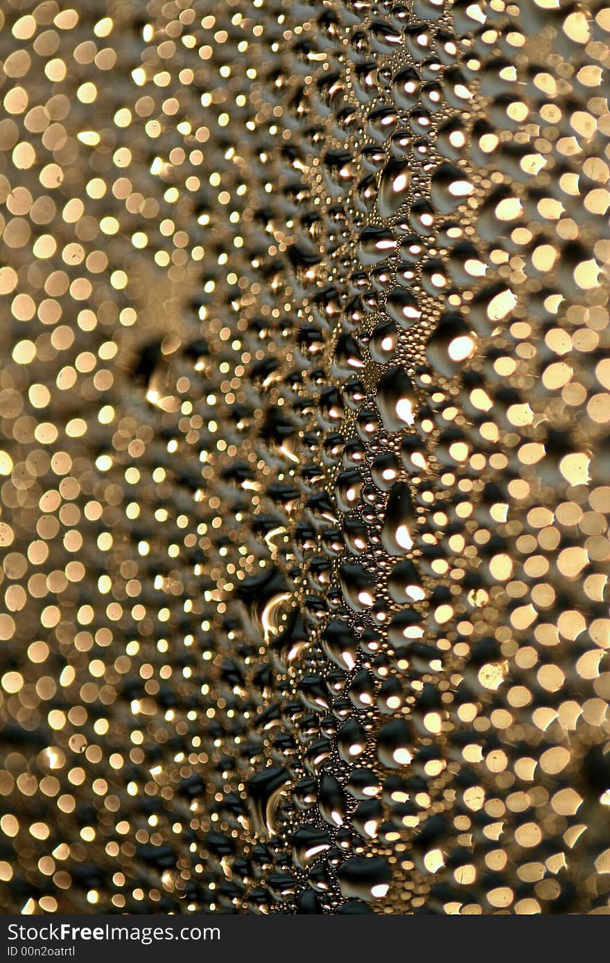 A detail of water condensed on window glass. A detail of water condensed on window glass.