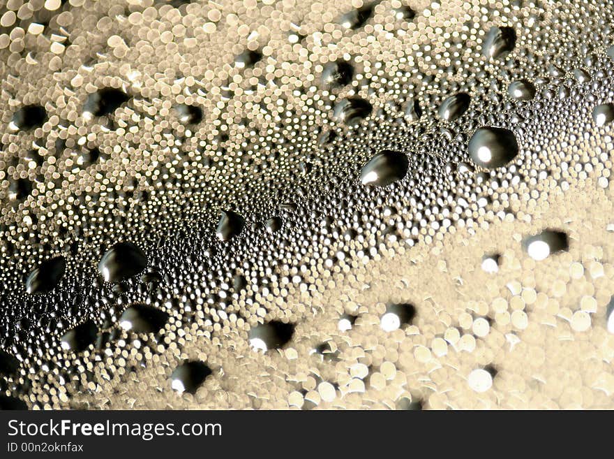 A detail of water condensed on window glass. A detail of water condensed on window glass.