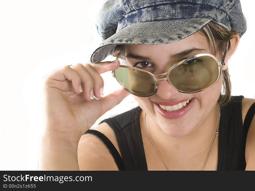 Portrait of a young attractive woman with glasses and cap