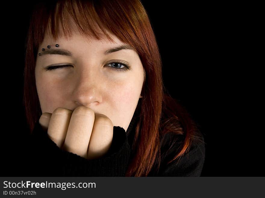 Redhead girl with one eye closed. Lit with three flashes, hair light green. Redhead girl with one eye closed. Lit with three flashes, hair light green.