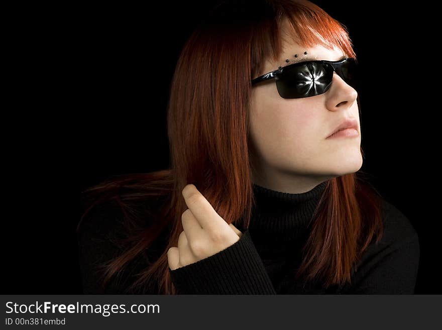 Girl playing with her hair. With sunglasses.

Lit with three studio strobes.